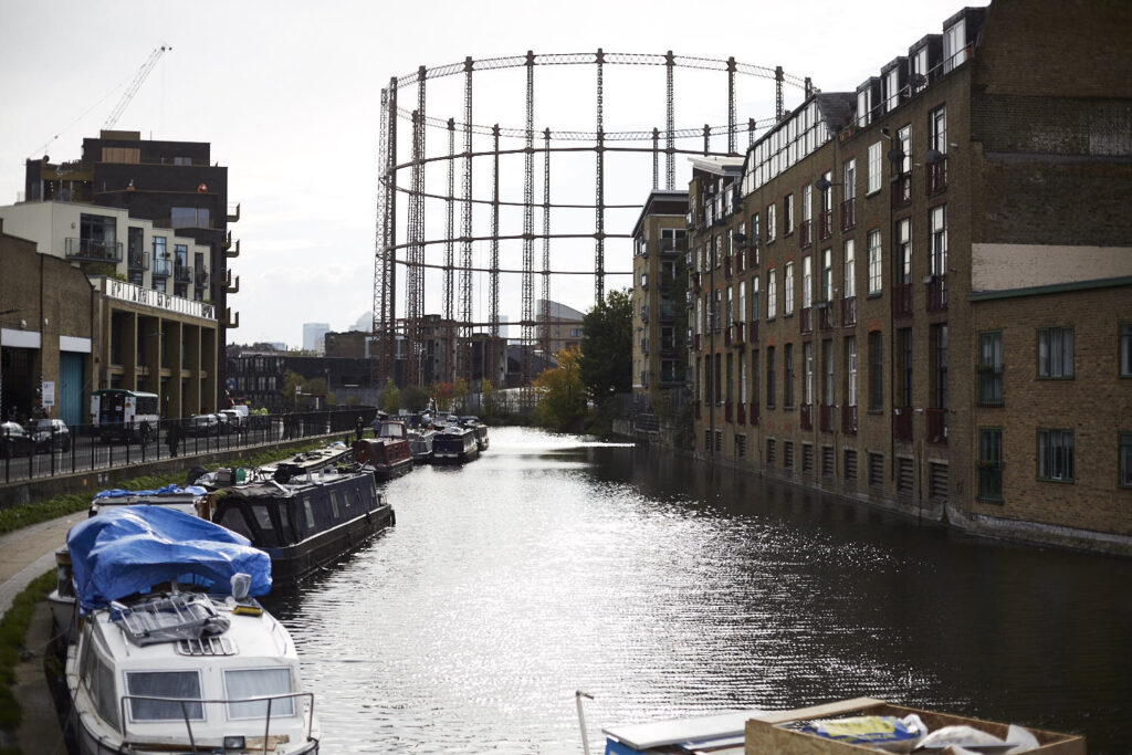 The canal in Hackney with old gas works in the background.