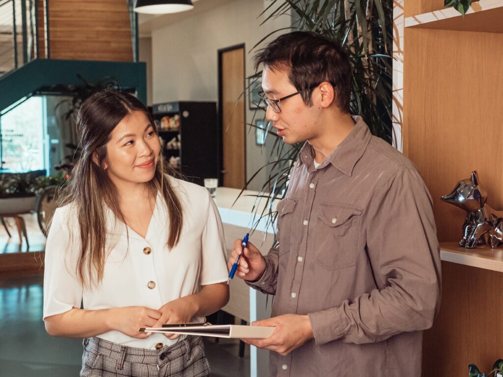 Asian male and female in an office environment